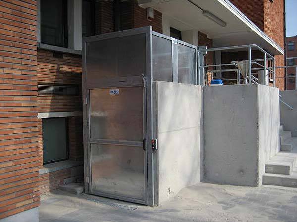 Exterior, weather proof goods and wheelchair lift fitted outside a Police Station