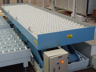 Scissor Lift with ball top transfer table integrated with feed and off-take conveyors